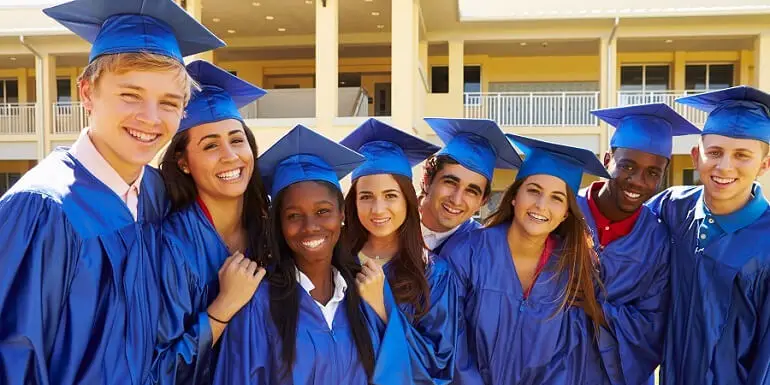 Group of Graduates in Blue Caps and Gowns