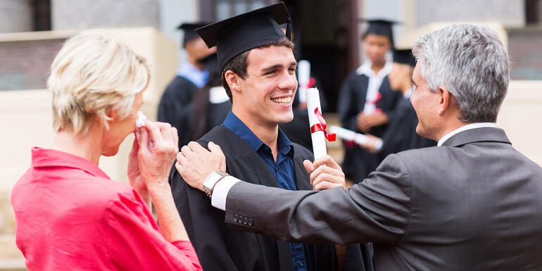 Male Graduate Congratulated by Parents